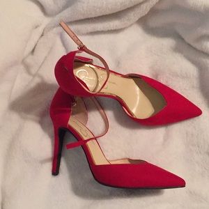 Deep red ankle strap heels.